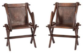 A pair of oak X frame armchairs of Glastonbury type, late 19th Century,