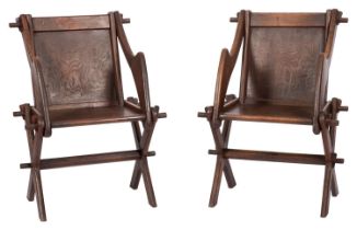 A pair of oak X frame armchairs of Glastonbury type, late 19th Century,