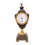 A French late-Georgian bronze and brass urn clock having an eight-day duration timepiece movement,