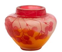 A small Gallé cameo glass vase decorated in red with gooseberries and foliage on an orange and