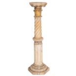 A Victorian carved alabaster jardiniere stand;