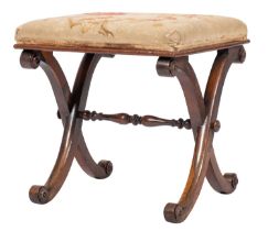 An early Victorian X-frame rosewood stool; the rectangular pad top with cabbage rose embroidery,