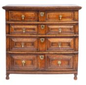 A Jacobean and later oak rectangular chest in two parts; the top with a moulded edge,