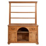 A 19th-century pine dresser; with an open shelved superstructure,