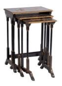 A nest of three rectangular black lacquer and chinoiserie occasional tables in the Oriental style;