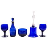 A mixed quantity of blue glass, including a 'Bristol' blue Rum decanter, table scent, a rolling pin,