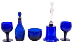 A mixed quantity of blue glass, including a 'Bristol' blue Rum decanter, table scent, a rolling pin,