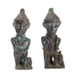 A pair of West African cast metal figures in the manner of Benin bronzes,