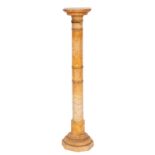 A late Victorian alabaster pedestal stand; the square top with canted angles,
