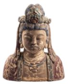 A carved wooden bust of Buddha, with gesso and polychrome painted decoration, 67cm high.