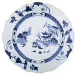 A Chinese blue and white 'Nanking Cargo' dish with scalloped rim,