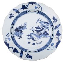 A Chinese blue and white 'Nanking Cargo' dish with scalloped rim,