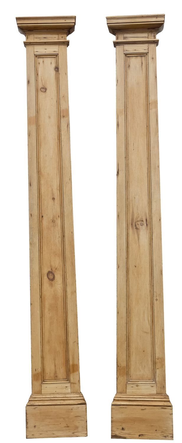 A pair of 19th-century pine architectural pilasters; with moulded tops,