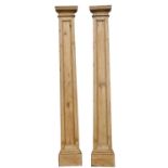 A pair of 19th-century pine architectural pilasters; with moulded tops,