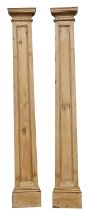 A pair of 19th-century pine architectural pilasters; with moulded tops,