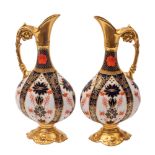 A pair of Royal Crown Derby porcelain ewers in the 'Old Imari' pattern [1128],