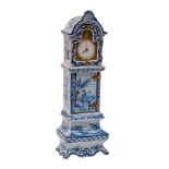 A Dutch blue and white delftware model of a longcase clock containing a late 18th Century watch