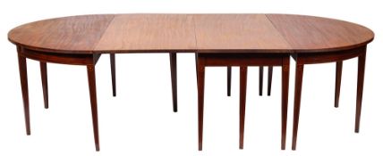 A George III mahogany and sycamore strung extending dining table, circa 1800; with two 'D' ends,