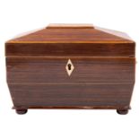 A Regency rosewood tea caddy, circa 1815; of sarcophagus form, with sycamore stringing throughout,