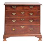 A mid 18th-century mahogany rectangular chest; the top with a moulded edge and rounded corners,