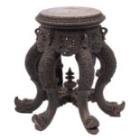 A carved hardwood circular Anglo-Indian jardiniere stand,