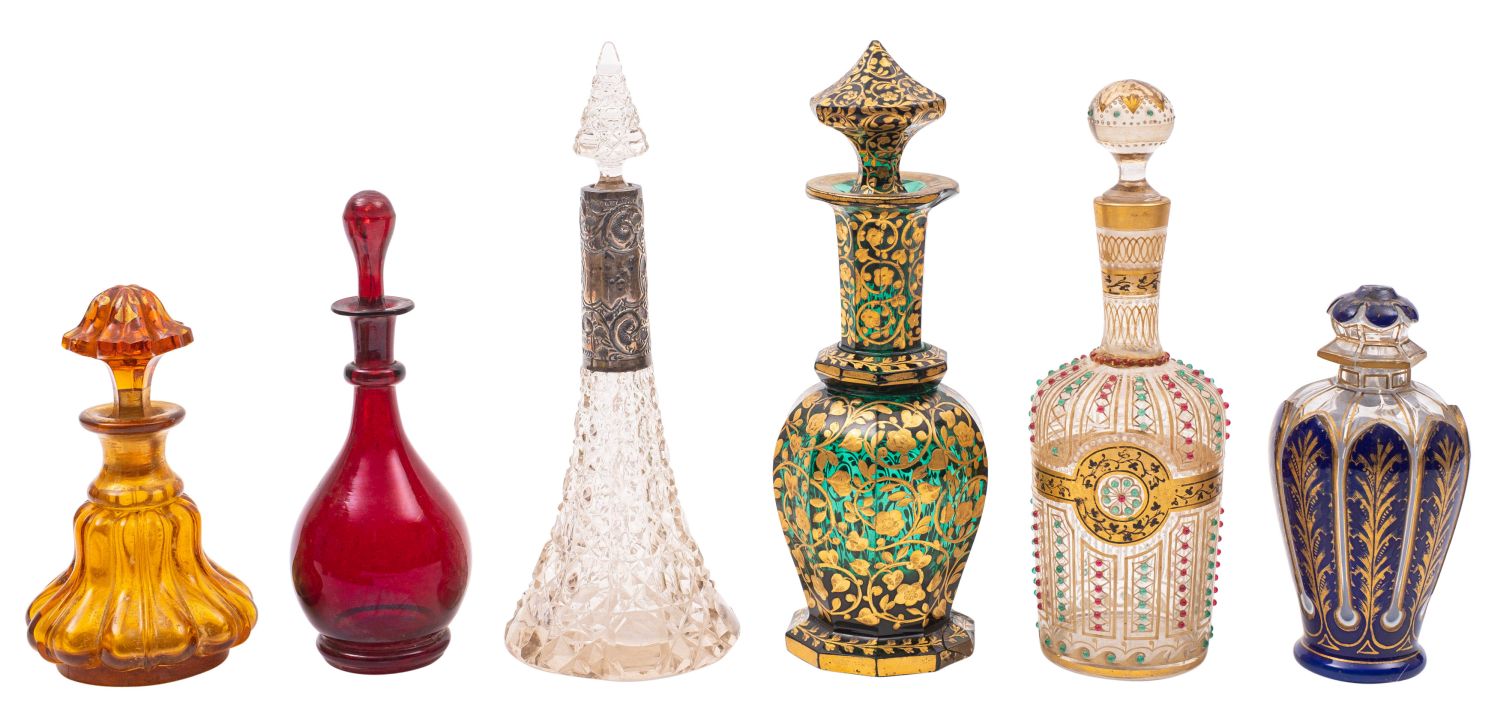 A group of ten late 19th century decorated and coloured glass scent bottles and stoppers together