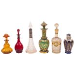 A group of ten late 19th century decorated and coloured glass scent bottles and stoppers together