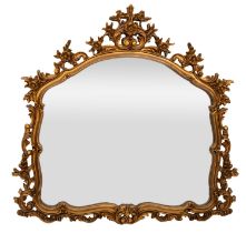 A Rococo style gilt composite wall mirror,