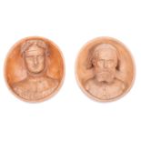 A pair of Continental terracotta oval wall plaques modelled in relief with Medieval head and