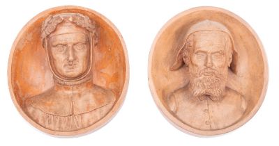 A pair of Continental terracotta oval wall plaques modelled in relief with Medieval head and