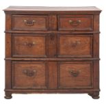 A Jacobean oak rectangular chest, containing two short and two long moulded panel drawers,