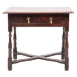 An early 18th-century oak and elm rectangular side table; with a moulded top,