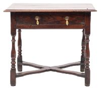An early 18th-century oak and elm rectangular side table; with a moulded top,