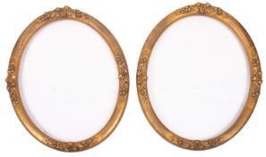 A pair of oval gilt composition picture or mirror frames,