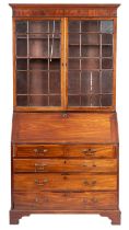 A George III mahogany bureau and an associated bookcase; the upper part with a moulded cornice,