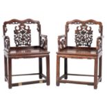 A pair of 19th-century Chinese huanghuali wood open armchairs;