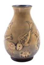 A William Moorcroft pottery vase, of flaring oviform tube lined in the fish pattern,