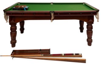 A Victorian mahogany metamorphic dining and billiards table, late 19th century; as a dining table,