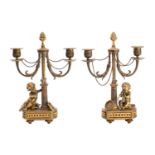 A pair of French gilt bronze twin light candelabra,