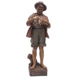 A Friedrich Goldscheider pottery figure, of a young barefoot boy in jacket, shorts and hat,