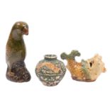 A group of two Chinese 'Diana Cargo' earthenware items and a similar small dragon jar in green,