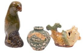 A group of two Chinese 'Diana Cargo' earthenware items and a similar small dragon jar in green,