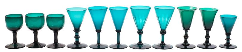 A mixed group of 'Bristol' green glass, primarily goblets and beakers, but including a tankard,