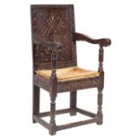 A 17th-century and later carved oak Wainscot chair;