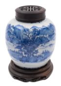A Chinese blue and white jar painted with a continuous mountainous lake landscape within borders of