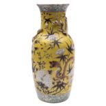 A Chinese yellow ground vase the neck with applied dragons and pleated rim,