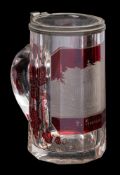 A ruby flashed spa tankard and cover with pewter mounts engraved with a named topographical view