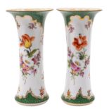 A pair of Dresden porcelain beaker vases painted in the Meissen style with floral sprays and sprigs
