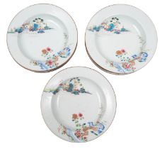 A set of twelve Chinese famille rose deep plates each painted with two vignettes depicting a pagoda