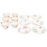 A set of six Minton porcelain 'butterfly' cups and saucers with butterfly handles and painted with